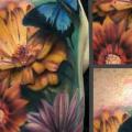 Shoulder Realistic Flower Butterfly tattoo by Art Junkies Tattoos