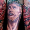 tatuaje Brazo Flor Religioso por Cecil Porter