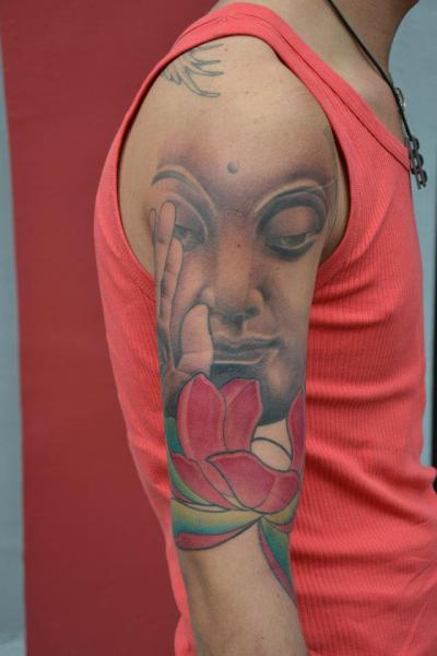 Shoulder Arm Buddha Religious Tattoo by Crazy Needle