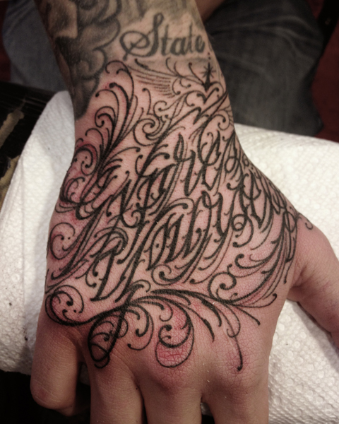 Lettering Hand Tattoo by Three Kings Tattoo