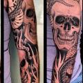 Snake Skull Sleeve tattoo by Three Kings Tattoo