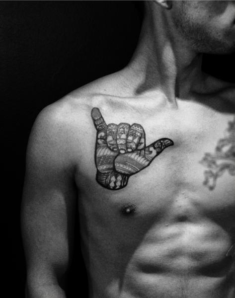 Chest Hand Tribal Tattoo by Maverick Ink