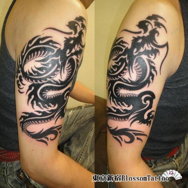 Shoulder Tribal Dragon Tattoo by Blossom Tattoo
