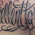 Chest Lettering tattoo by Tattoo Nero