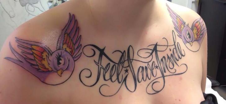 Shoulder Lettering Breast Tattoo by Tattoo Nero
