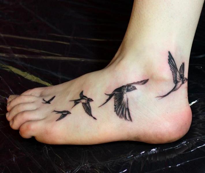 Realistic Swallow Foot Tattoo by Endorfine Studio