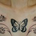 Butterfly Tribal Breast tattoo by Daichi Tattoos & Artworks