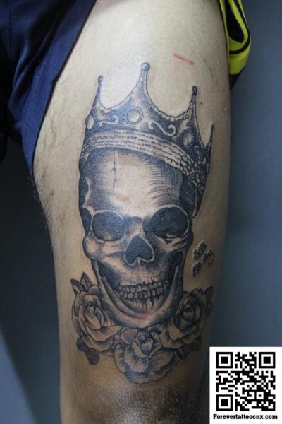 Skull Crown Thigh Tattoo by Forevertattoo Studio