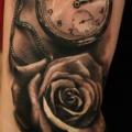 Arm Realistic Clock Flower tattoo by Led Coult