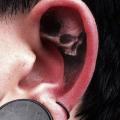 Skull Ear tattoo by Jak Connolly