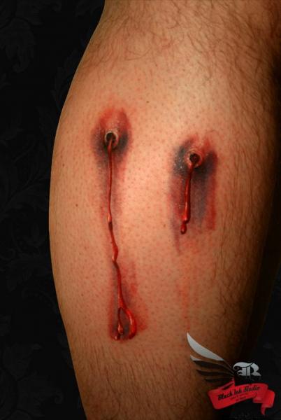 Calf Blood Hole Tattoo by Black Ink Studio
