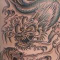 tatuaggio Braccio Tigre Draghi di Body Line Tattoo