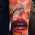 Arm Bee Mouth Honey tattoo by Piranha Tattoo Studio