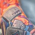 Hand Zippo tattoo by Electrographic Tattoo