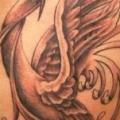 tatuaggio Fantasy Fianco Fenice di Herzstich Tattoo