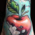 Hand Apple tattoo by Pawel Skarbowski