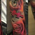 Arm Blumen Auge Puzzle tattoo von Victoria Boaghi