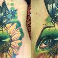 tatuaje Lado Mariposa Girasol por Victoria Boaghi