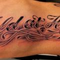 Side Lettering tattoo by Fairlane Tattoo