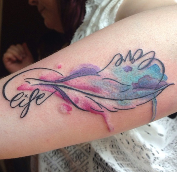 Arm Feather Lettering Water Color Tattoo by Sacred Art Tattoo