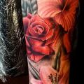 Arm Realistic Flower tattoo by Sacred Art Tattoo