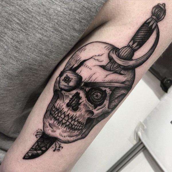 Arm Skull Dagger Tattoo by Sacred Art Tattoo