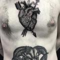 Brust Herz Dotwork tattoo von Sacred Art Tattoo