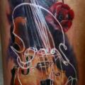 Realistic Flower Thigh Violin tattoo by Valentina Riabova