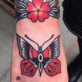 Old School Hand Butterfly tattoo by Cloak and Dagger Tattoo