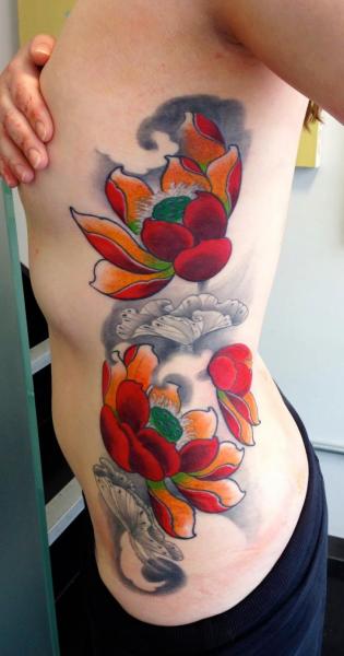 Flower Side Lotus Tattoo by Dalmiro Tattoo