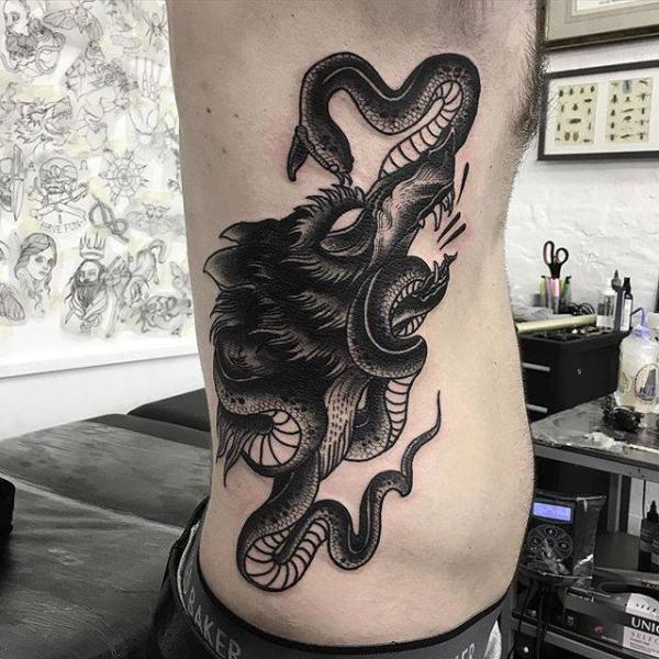 Snake Side Wolf Tattoo by Parliament Tattoo