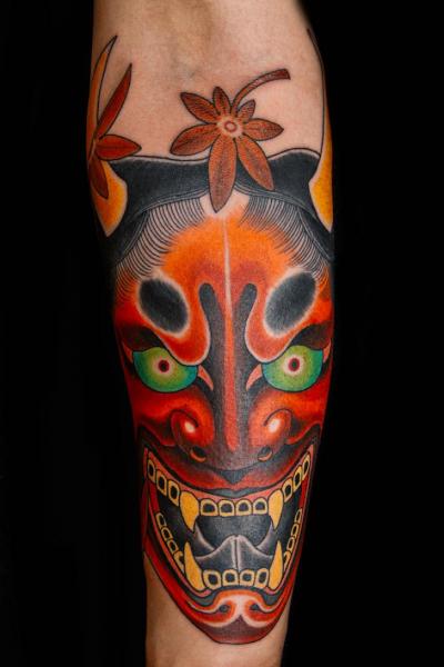 Arm Japanese Mask Tattoo by Kings Avenue Tattoo