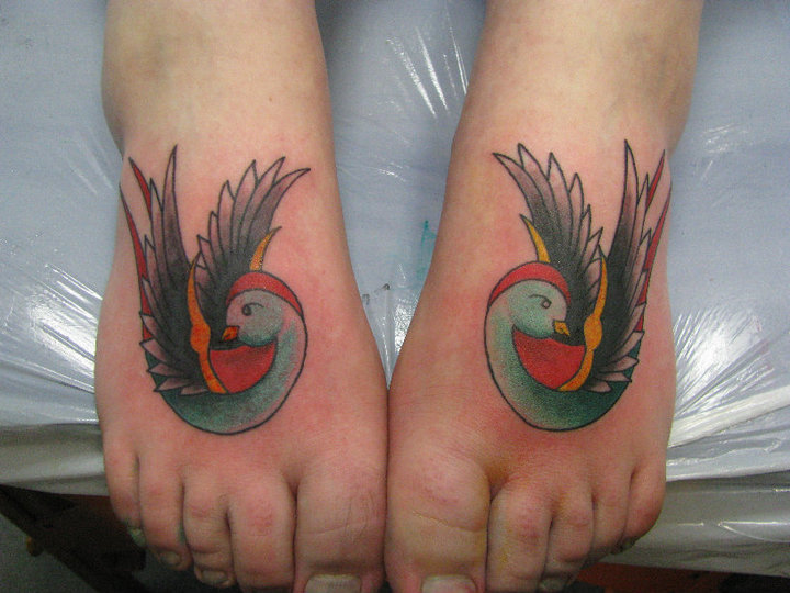 Old School Swallow Foot Tattoo by Crossroad Tattoo
